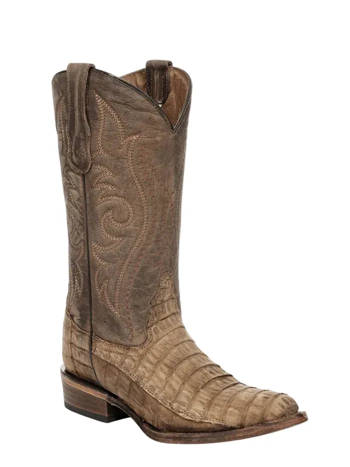 A single brown western cowboy boot with a crocodile-embossed toe and shaft, featuring stitched scrollwork on the upper shaft, shown against a plain off-white background.