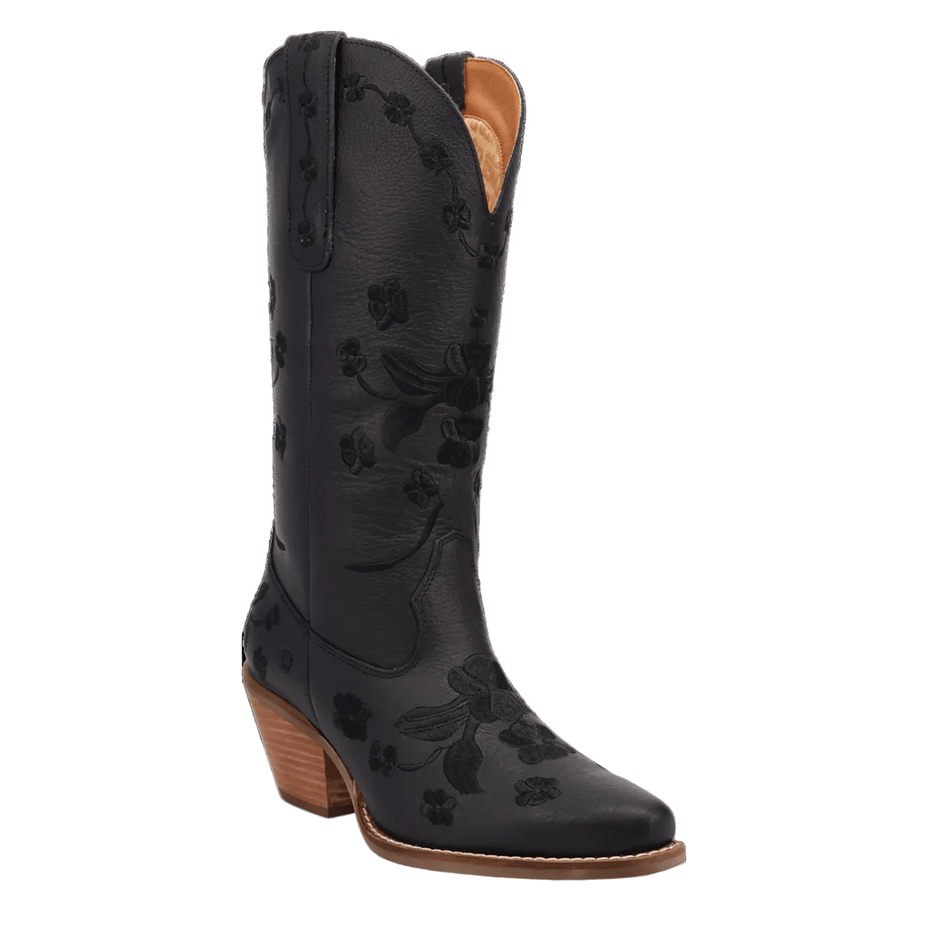 A black leather cowboy boot with floral embossed detailing, a pointed toe, and a stacked wood-look heel, shown against a plain white background.