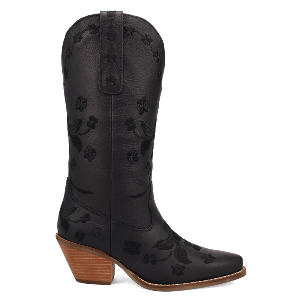 A black leather cowboy boot with an embossed floral pattern, a pointed square toe, and a stacked wood-look block heel, shown against a plain white background.