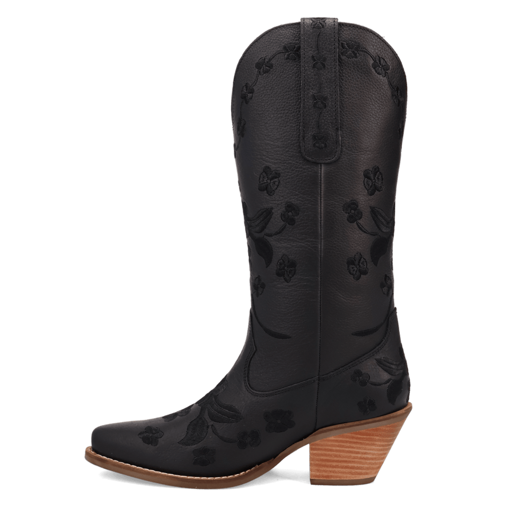 A black leather cowboy boot with an embossed floral pattern, a pointed toe, and a stacked wood-look block heel, shown against a plain white background.
