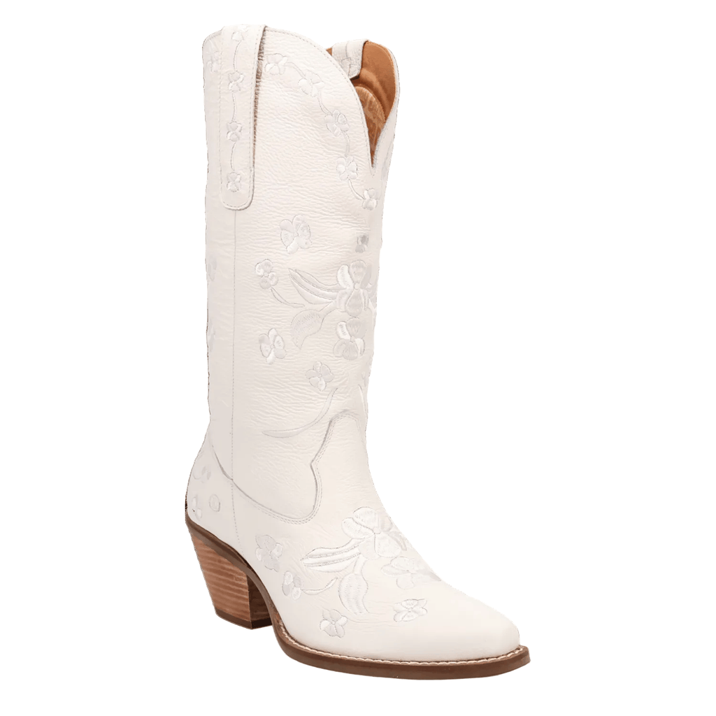 A white leather cowboy boot with floral embroidery on the shaft and toe, featuring a stacked brown block heel and a pointed toe, shown against a plain white background.