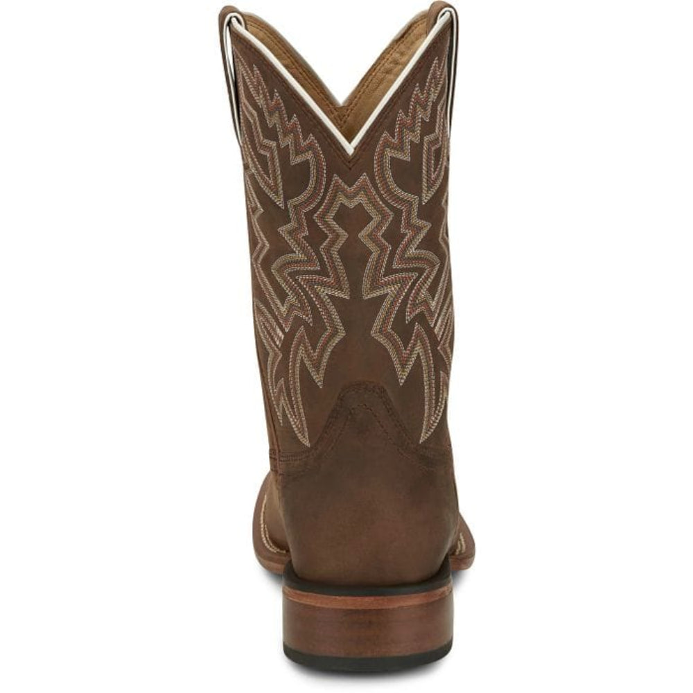 Brown cowboy boot with intricate brown stitching pattern on the upper shaft. 