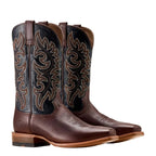 Pair of brown cowboy boot with a black upper shaft and intricate brown stitching on a white background