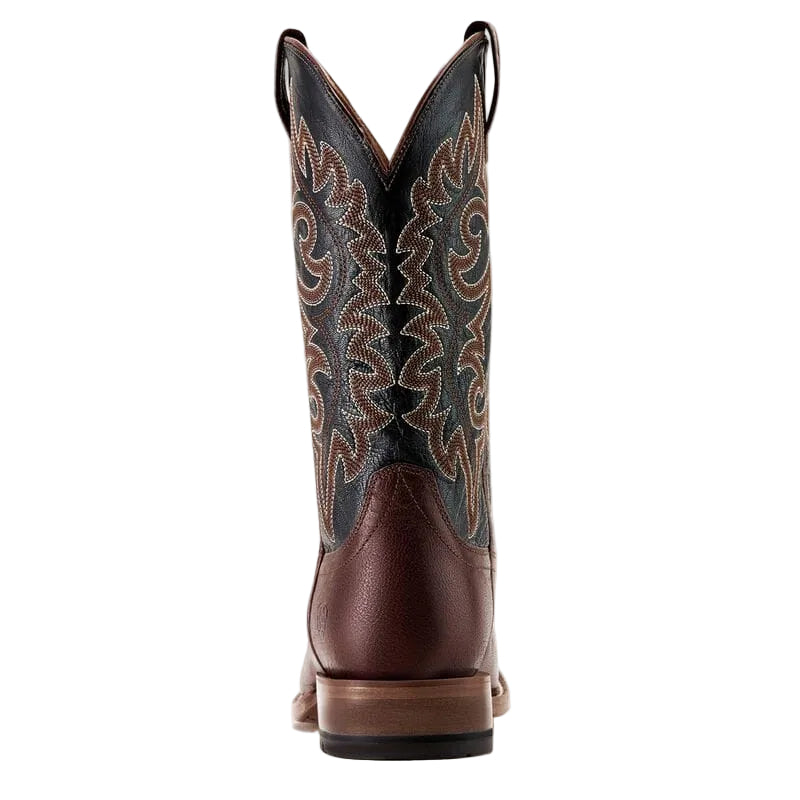 Brown Cowboy boot with a black upper shaft and intricate brown stitching on a white background